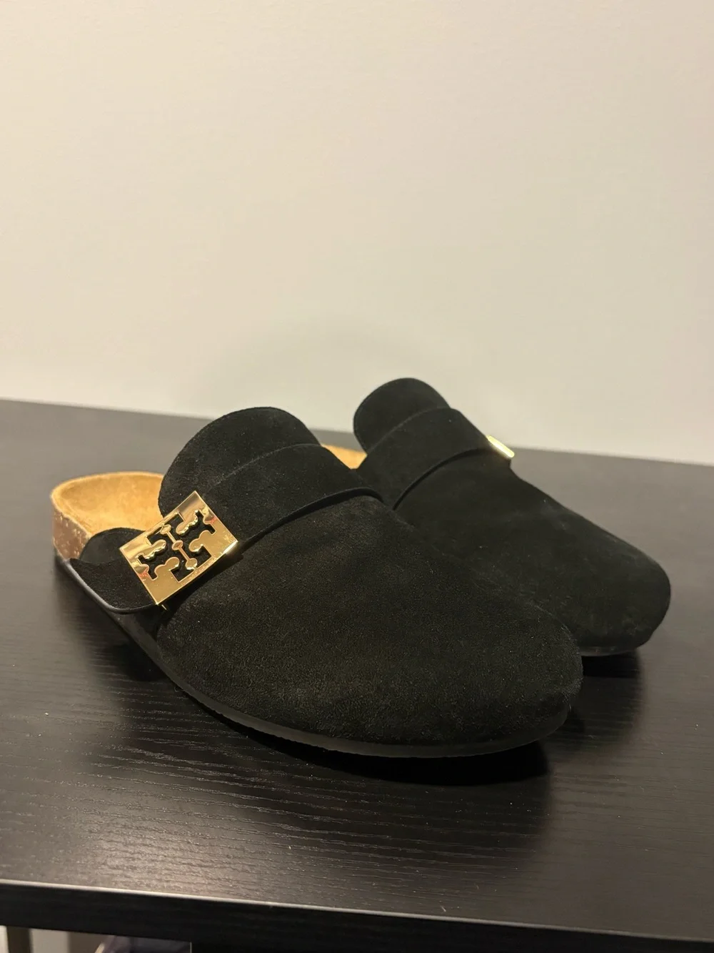 Tory Burch black suede slip-on mules in a size 7.5